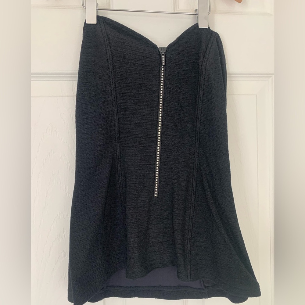 Black strapless tub top with 3/4 zippered front adorned with rhinestones